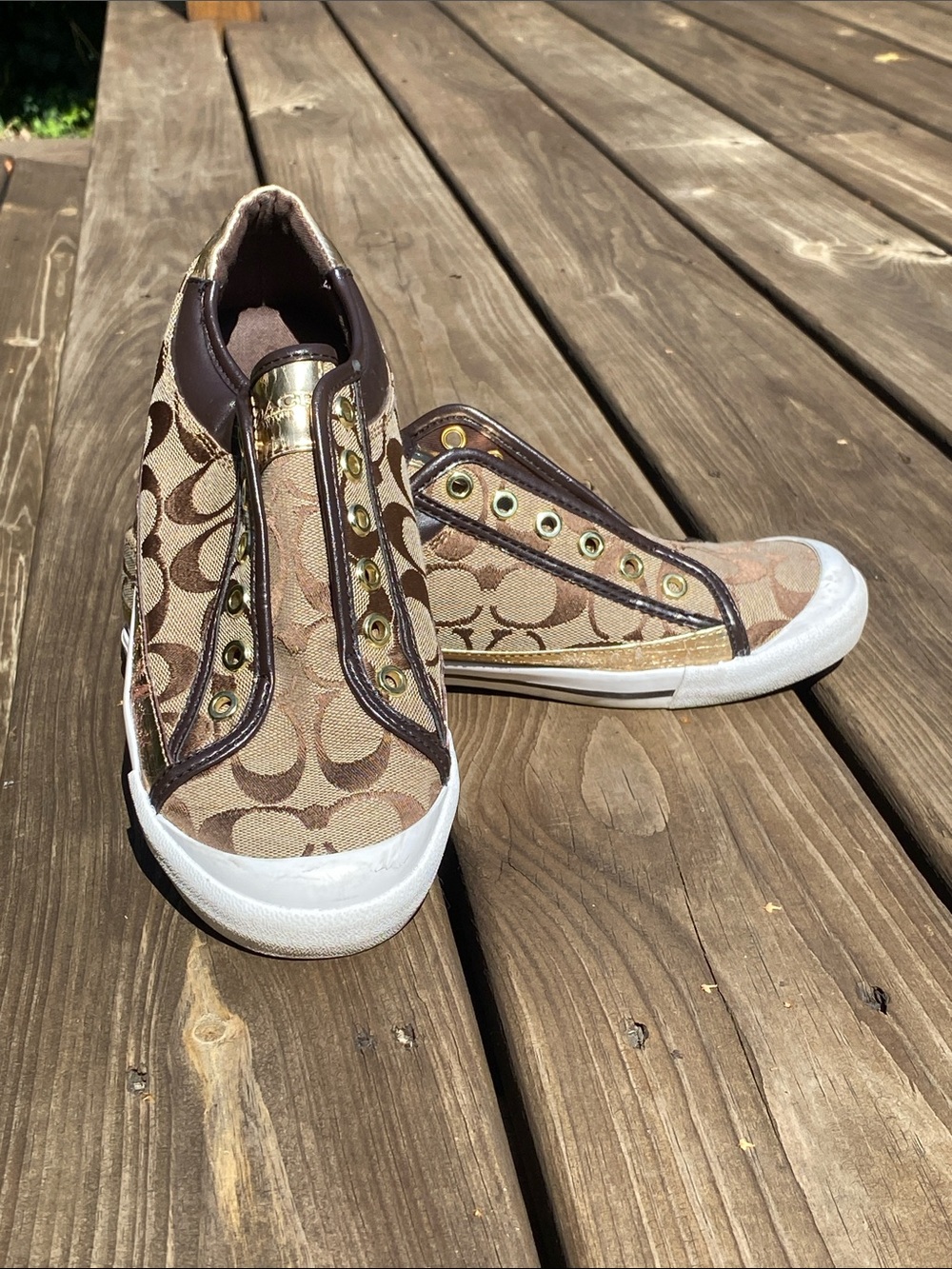 Coach Women’s Slip-On Signature Canvas Sneakers in Brown and White